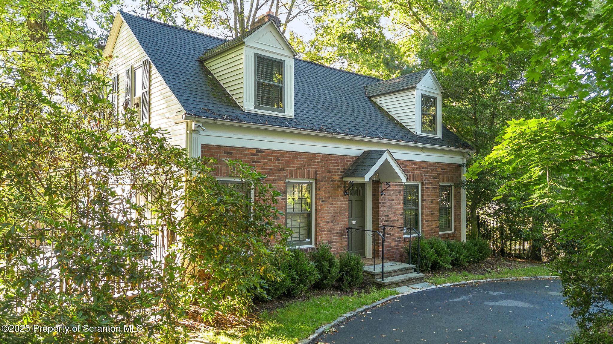 111 Upper Knapp Road Clarks Summit, PA 18411 - Photo 1 of 52 a front view of a house with garden