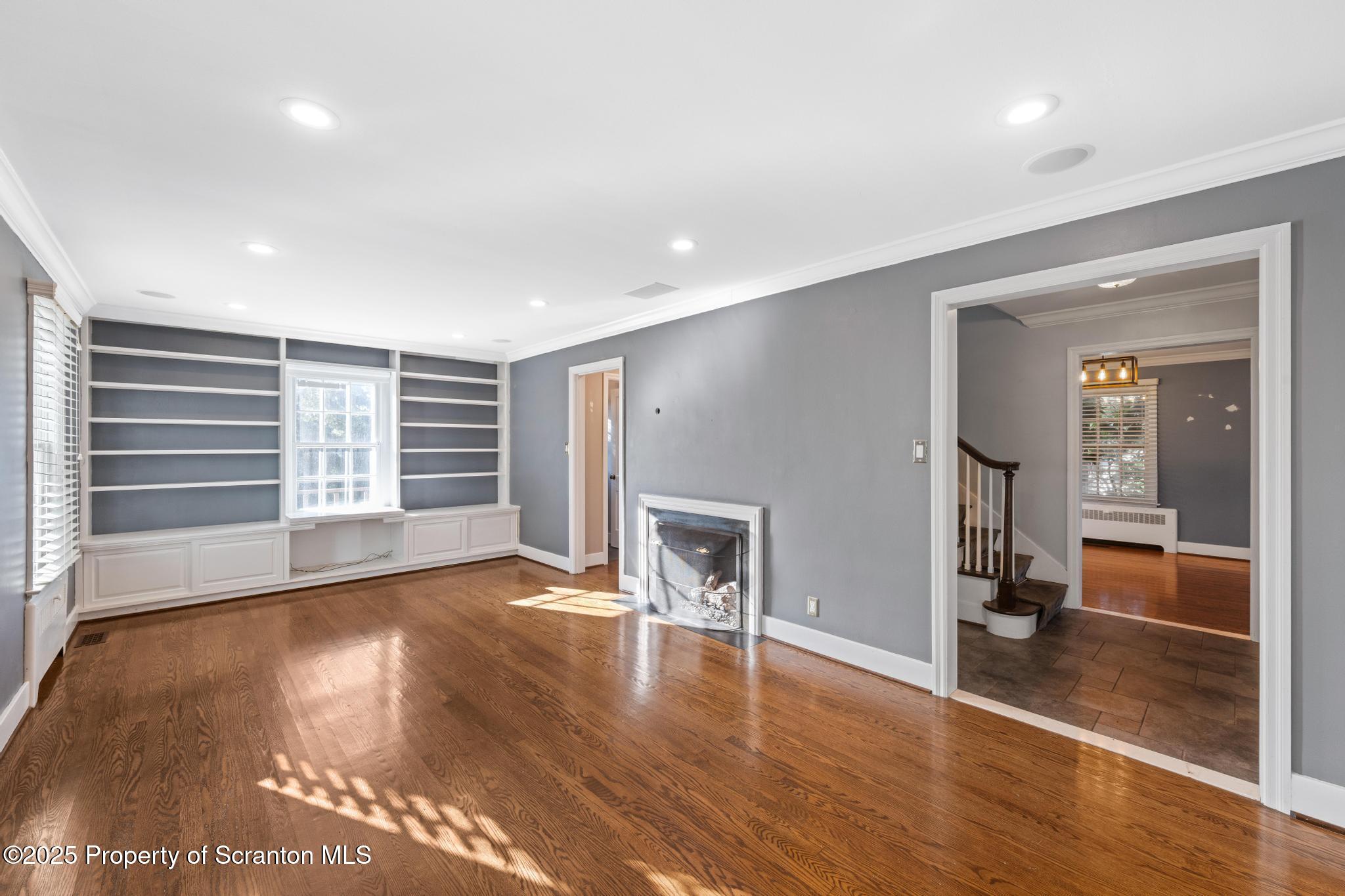 111 Upper Knapp Road Clarks Summit, PA 18411 - Photo 16 of 52 an empty room with wooden floor and windows