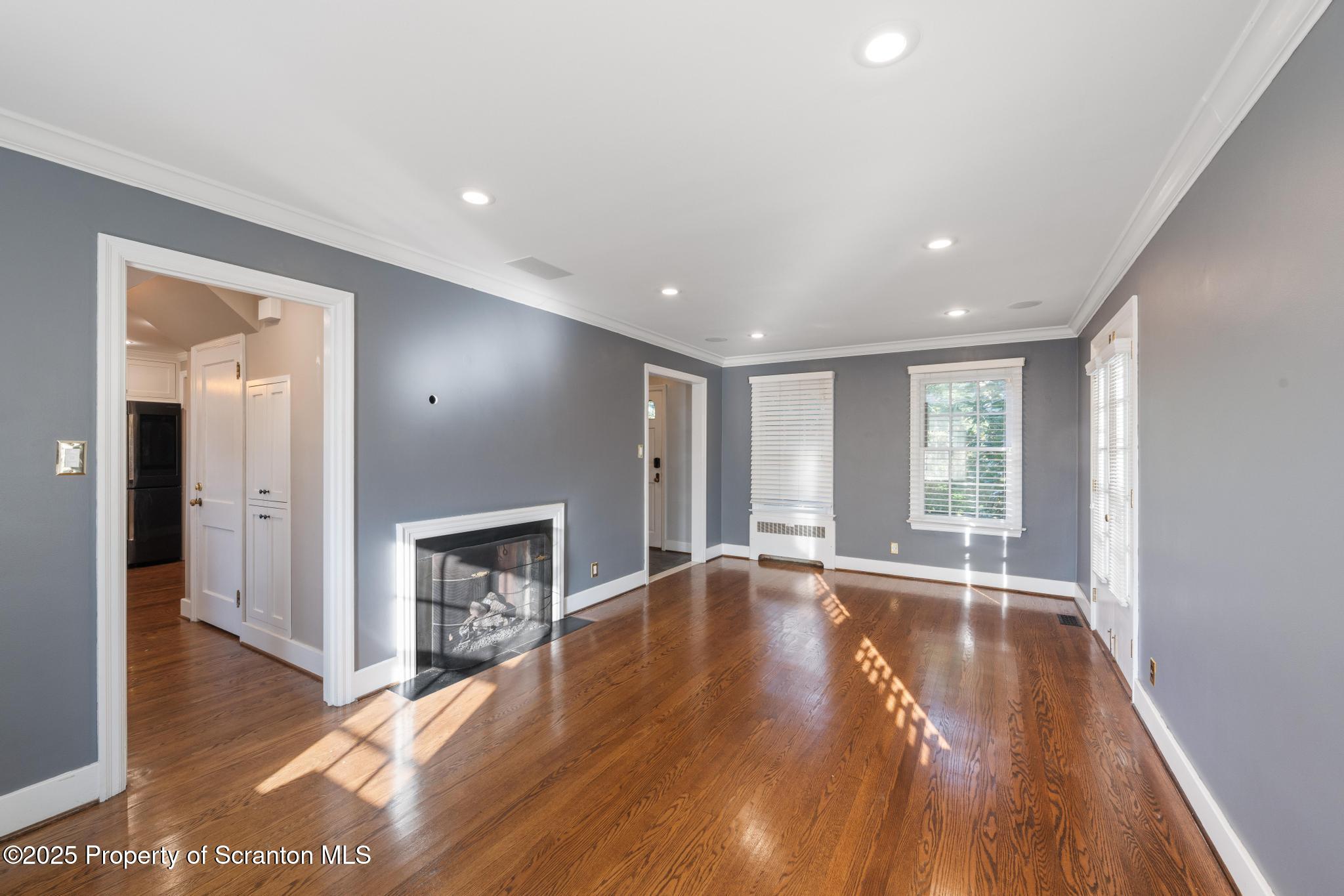 111 Upper Knapp Road Clarks Summit, PA 18411 - Photo 18 of 52 a view of an empty room with wooden floor and a window