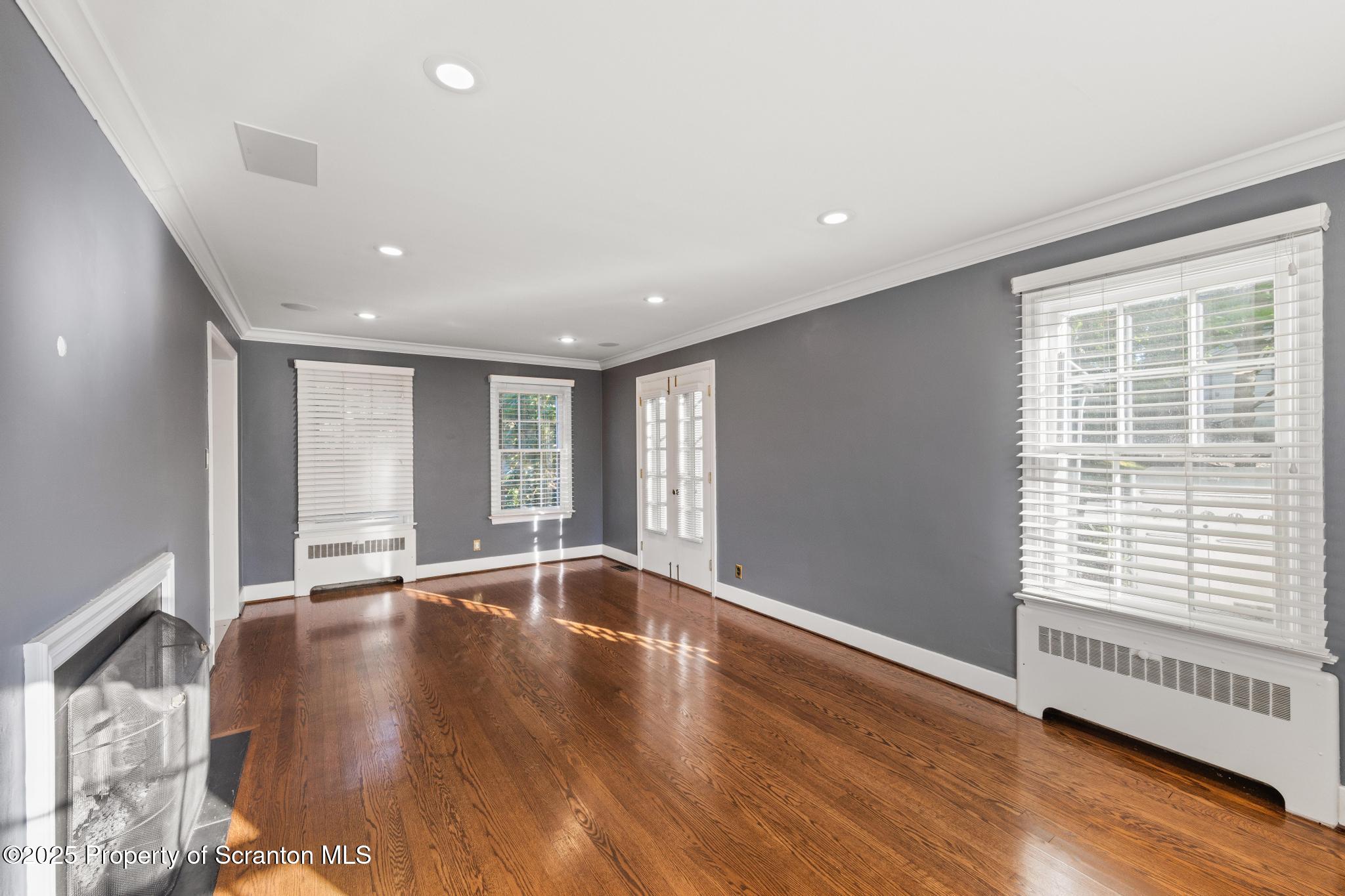 111 Upper Knapp Road Clarks Summit, PA 18411 - Photo 19 of 52 a view of an empty room with wooden floor and a window