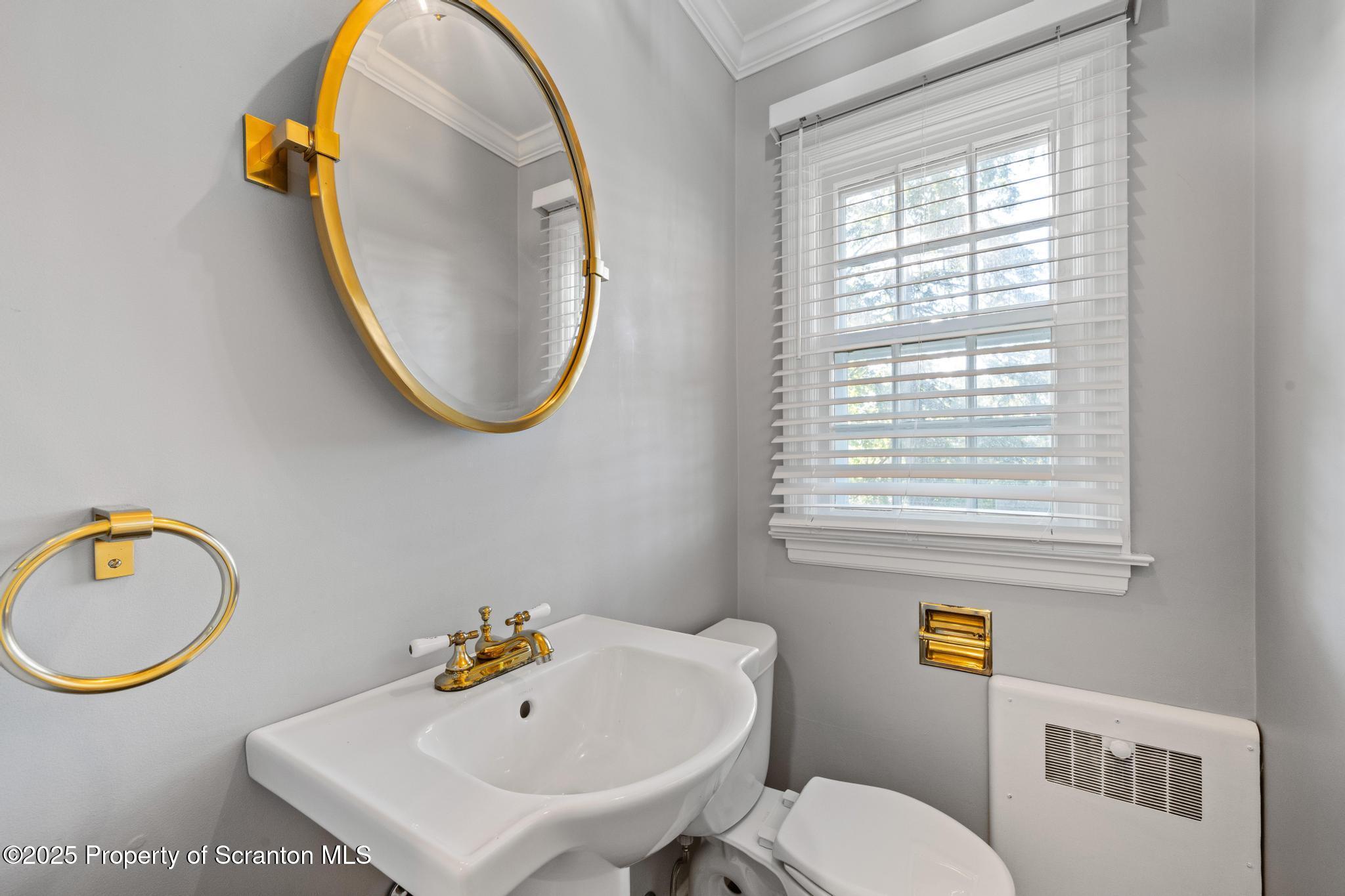 111 Upper Knapp Road Clarks Summit, PA 18411 - Photo 20 of 52 a bathroom with a sink a toilet and a mirror