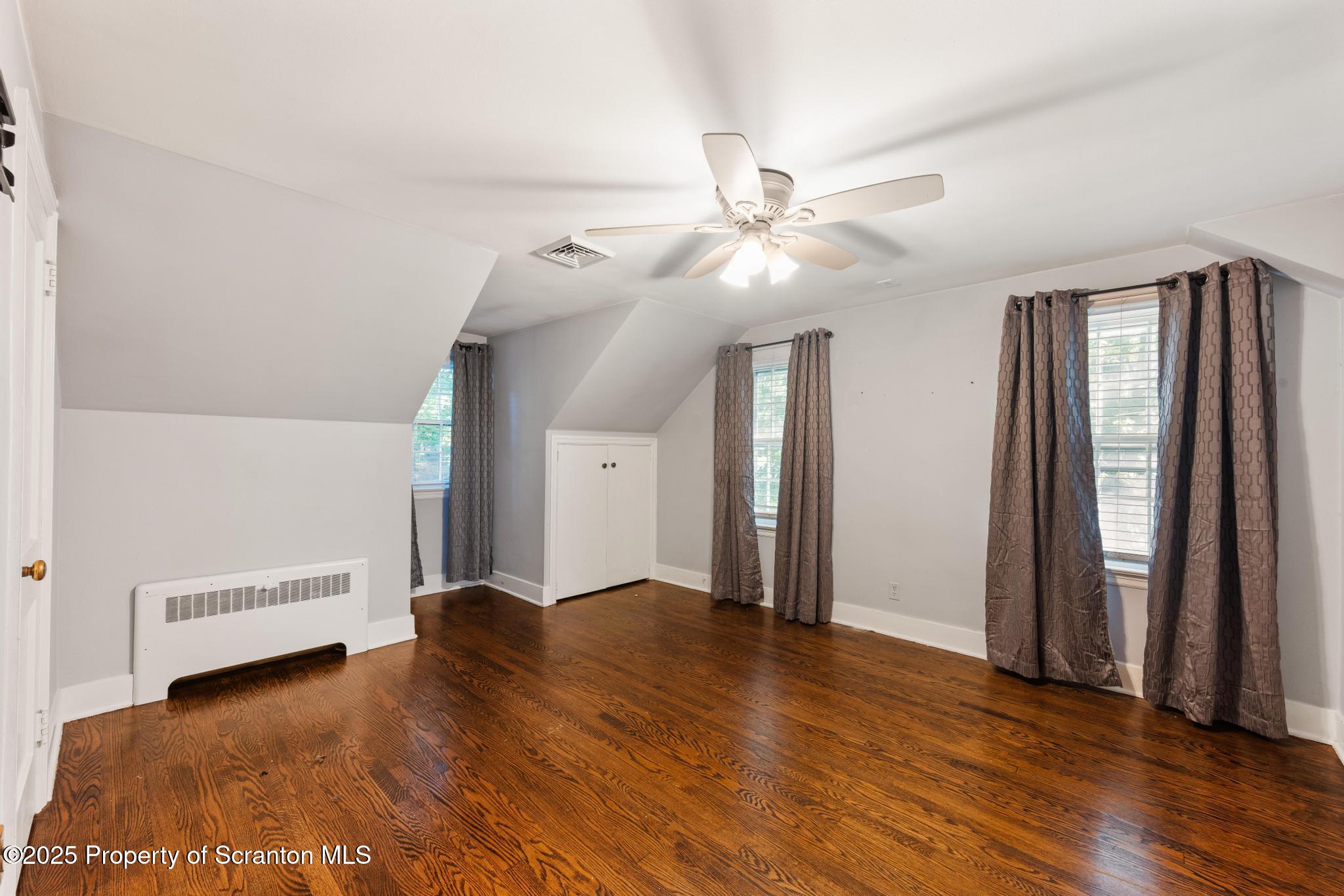 111 Upper Knapp Road Clarks Summit, PA 18411 - Photo 25 of 52 a view of an empty room with window and wooden floor