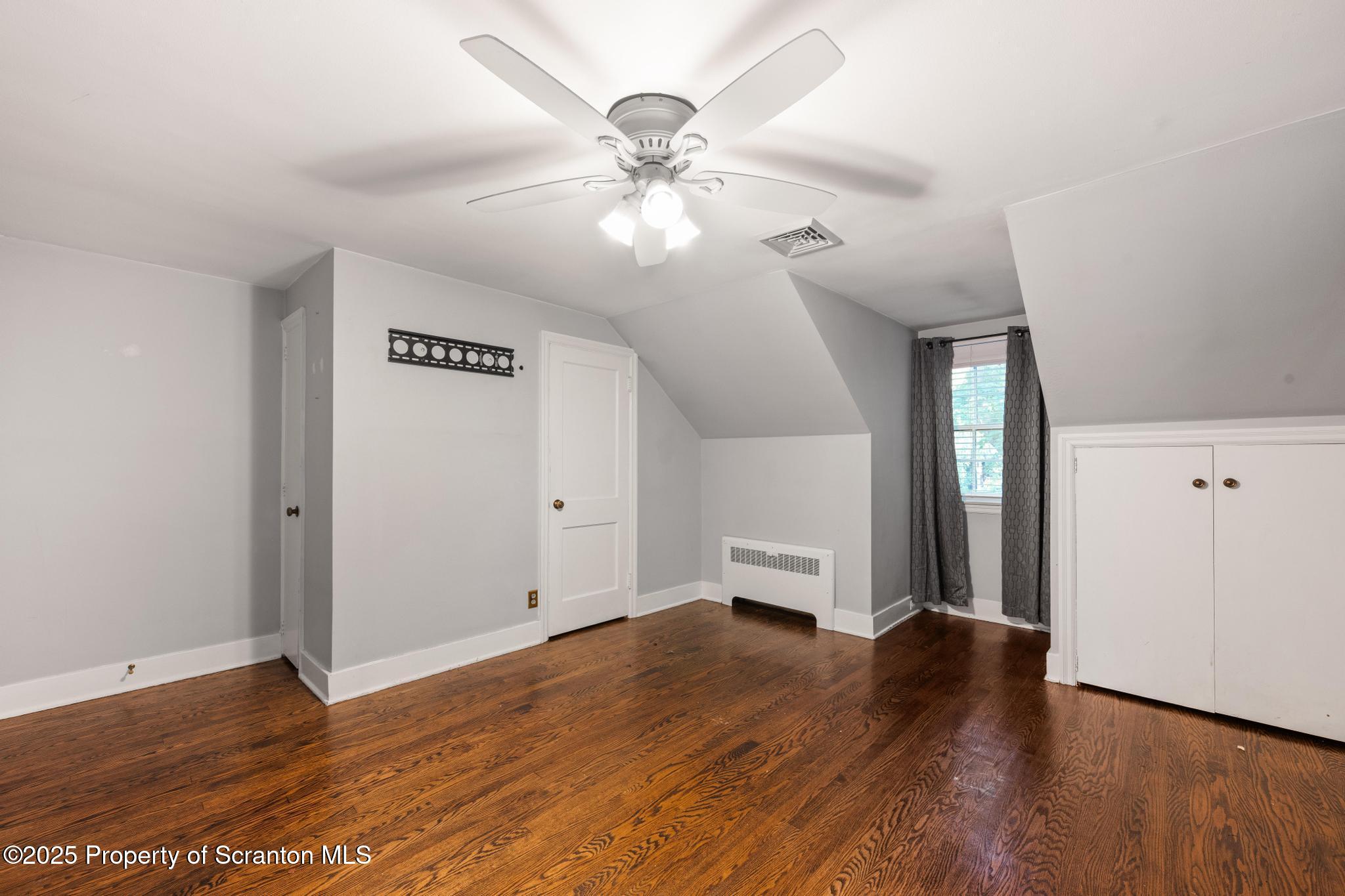 111 Upper Knapp Road Clarks Summit, PA 18411 - Photo 26 of 52 wooden floor in an empty room with a window