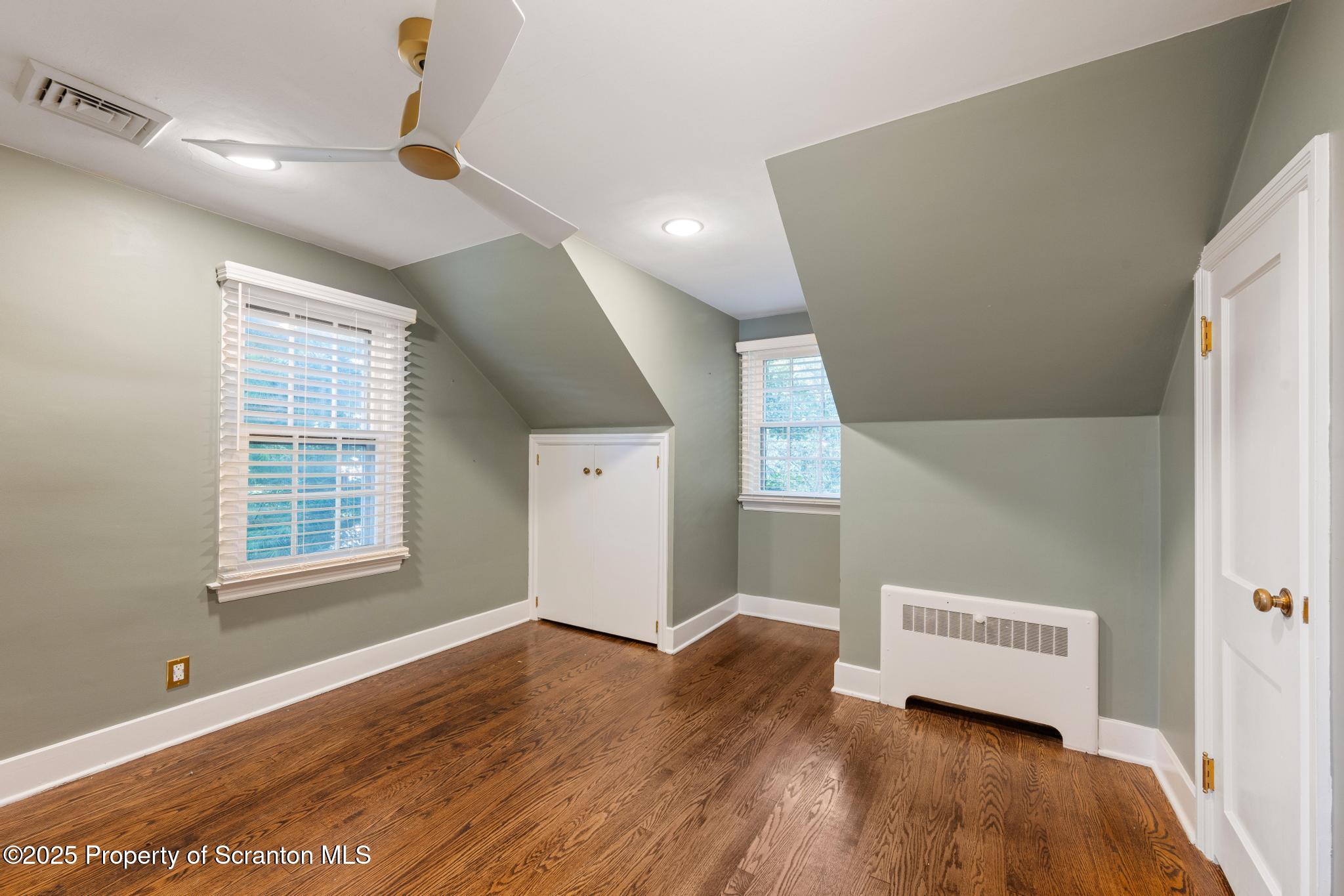 111 Upper Knapp Road Clarks Summit, PA 18411 - Photo 27 of 52 a view of an empty room with wooden floor and a window