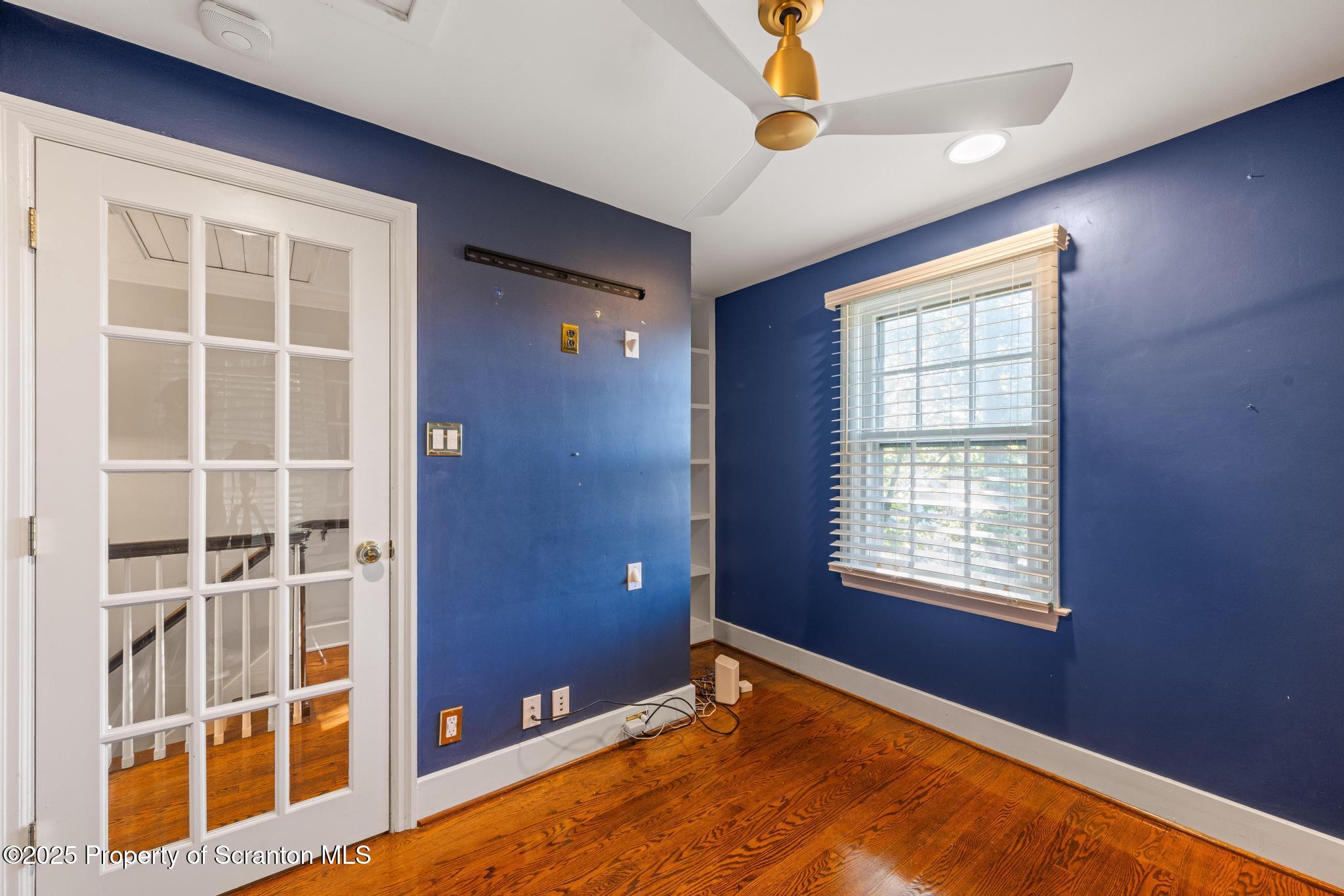 111 Upper Knapp Road Clarks Summit, PA 18411 - Photo 29 of 52 a view of an empty room with a window and wooden floor