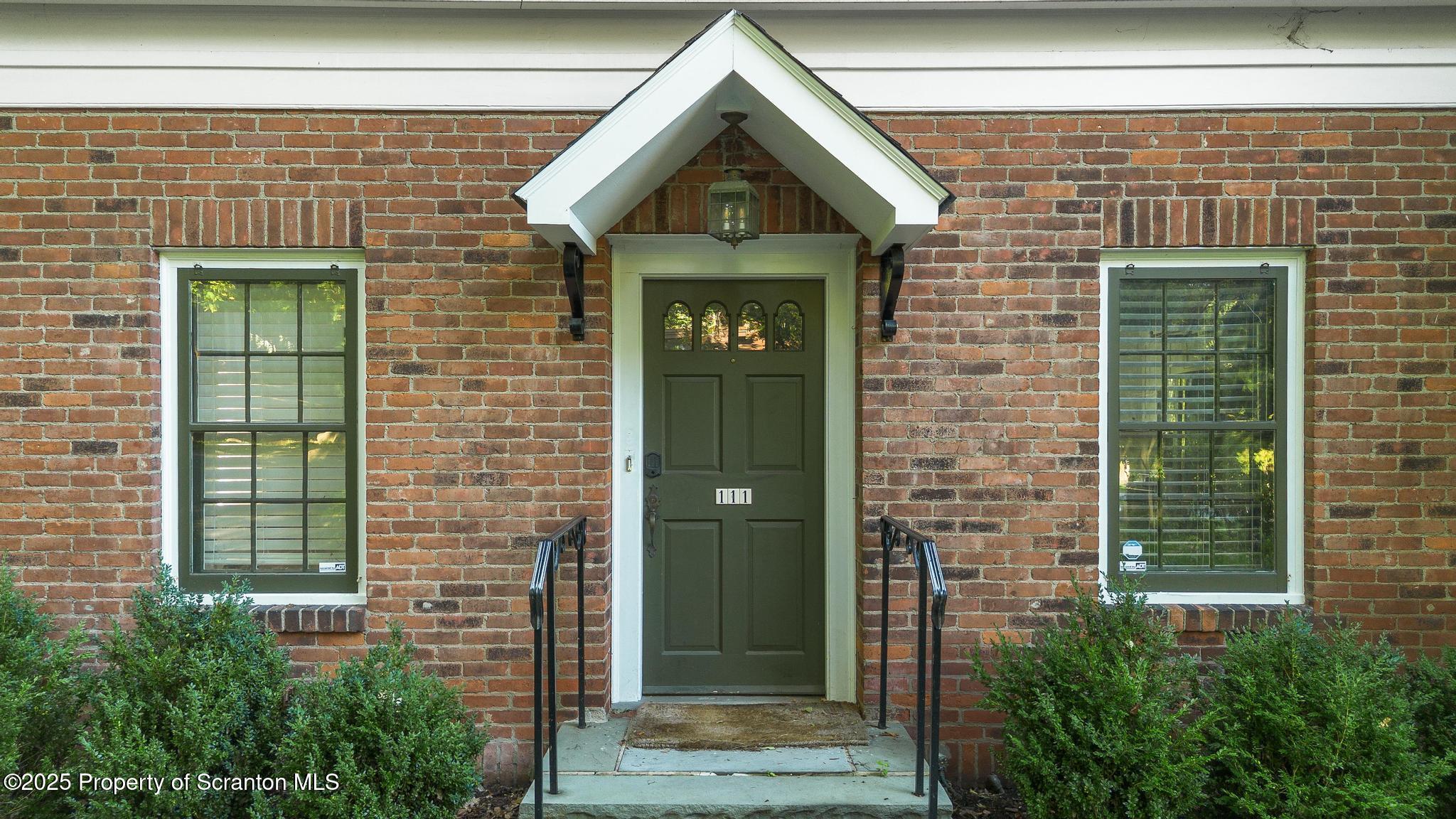 111 Upper Knapp Road Clarks Summit, PA 18411 - Photo 4 of 52 a front view of a house with a garden