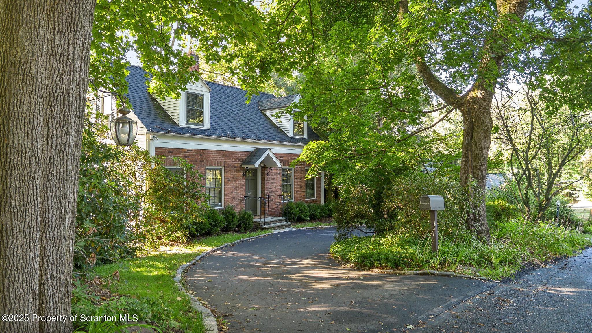 111 Upper Knapp Road Clarks Summit, PA 18411 - Photo 45 of 52 a front view of a house with garden