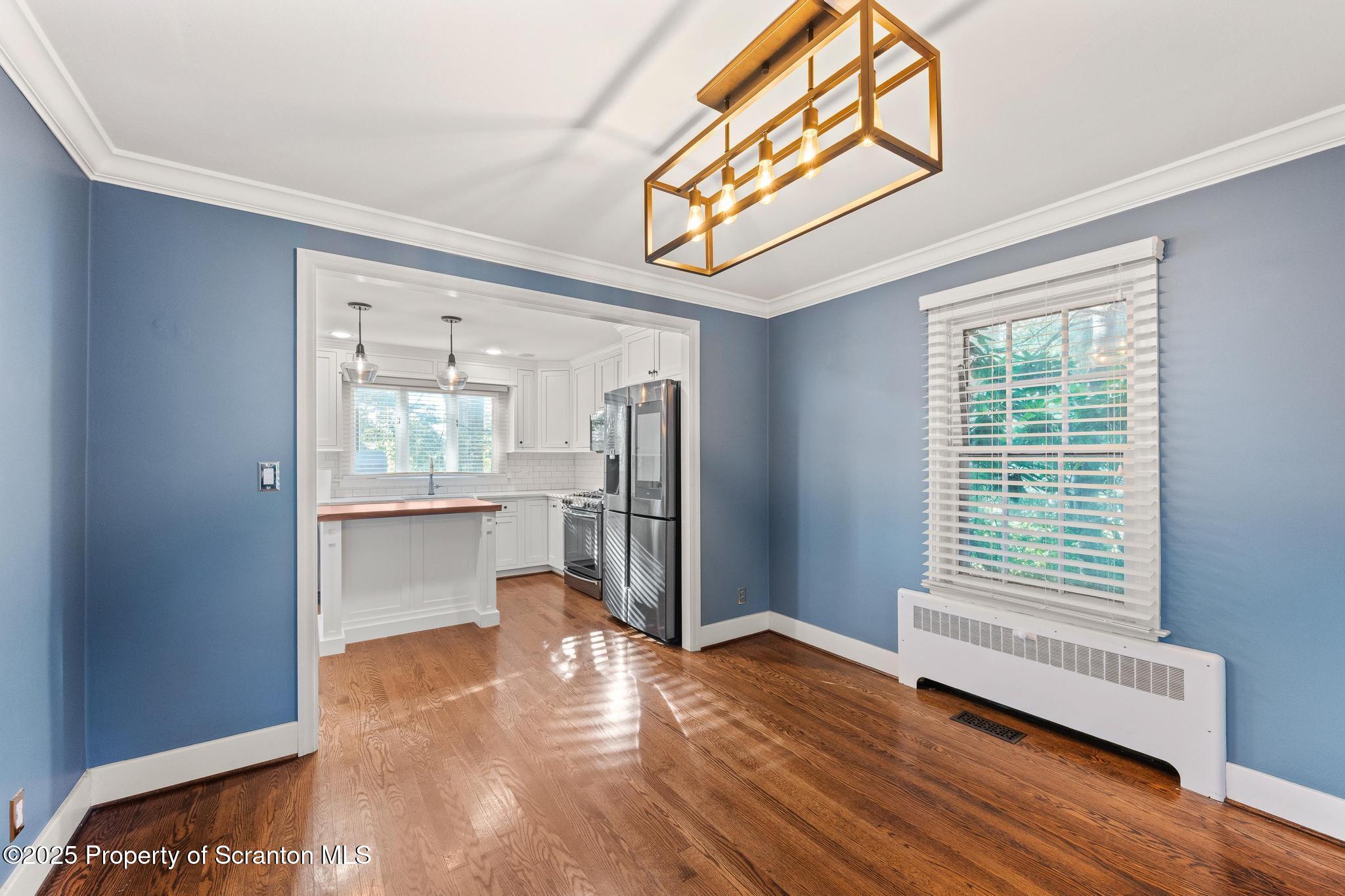 111 Upper Knapp Road Clarks Summit, PA 18411 - Photo 6 of 52 a view of an empty room with wooden floor and a window