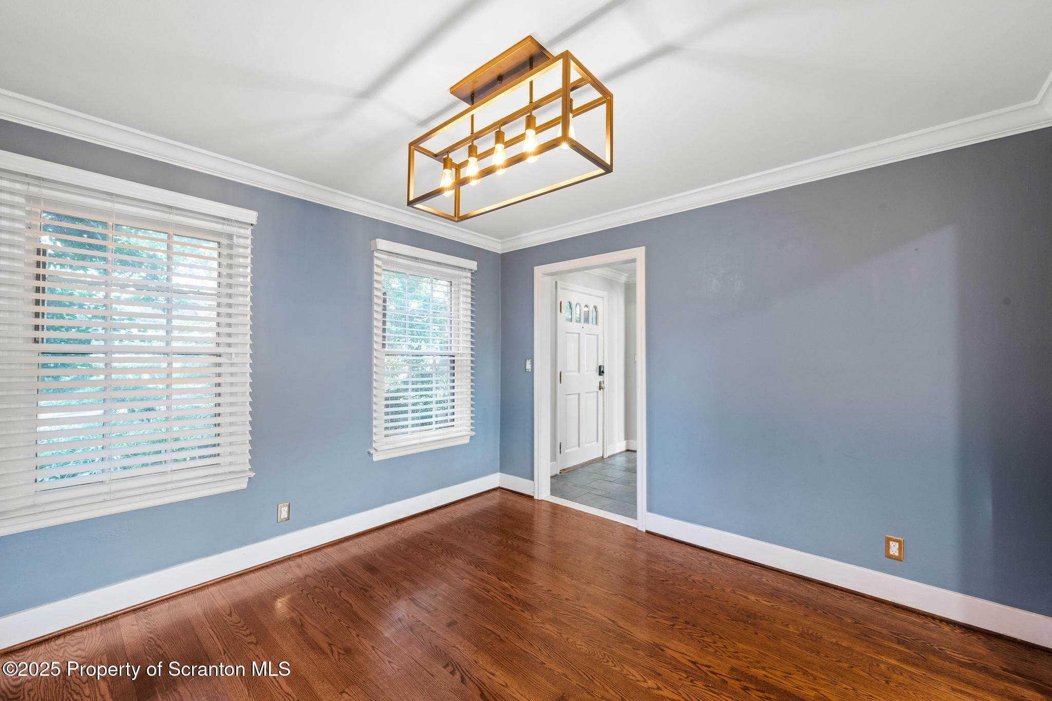 111 Upper Knapp Road Clarks Summit, PA 18411 - Photo 7 of 52 a view of empty room with wooden floor and fan