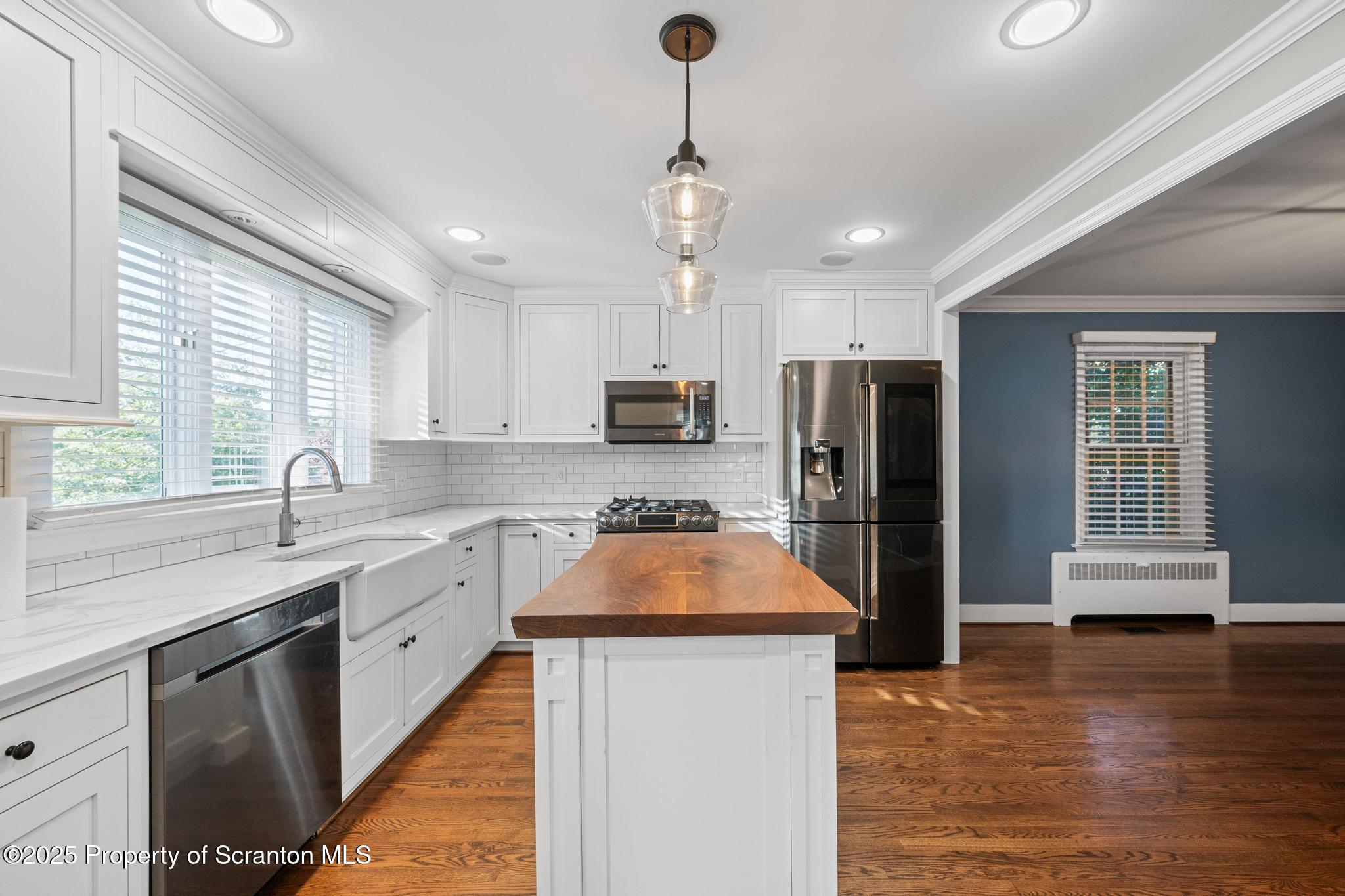 111 Upper Knapp Road Clarks Summit, PA 18411 - Photo 9 of 52 a kitchen with stainless steel appliances granite countertop a sink stove and refrigerator