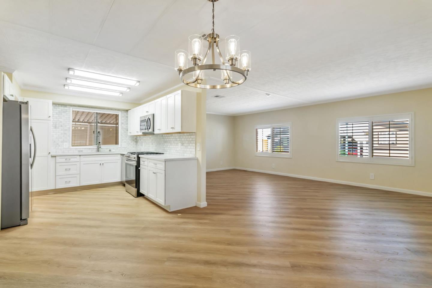 3263 Vineyard, Unit 132 Pleasanton, CA 94566 - Photo 13 of 34 a view of a kitchen with a sink cabinets and wooden floor