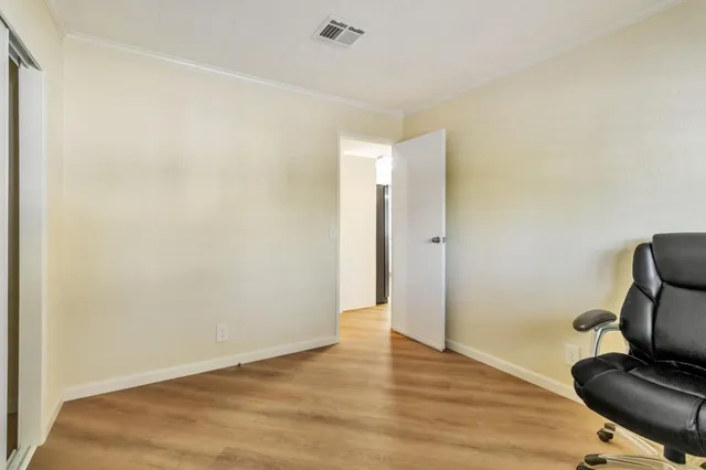 a view of workspace with wooden floor