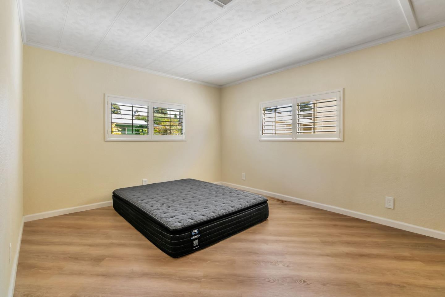 3263 Vineyard, Unit 132 Pleasanton, CA 94566 - Photo 16 of 34 an empty room with wooden floor and window