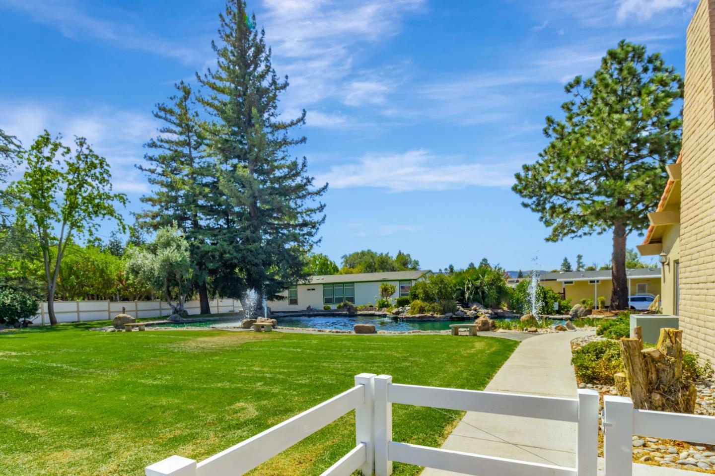 3263 Vineyard, Unit 132 Pleasanton, CA 94566 - Photo 26 of 34 a front view of a house with a yard