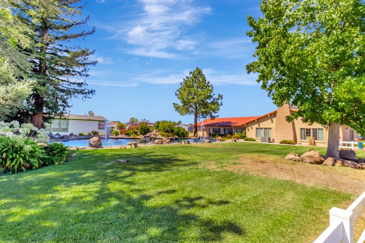 3263 Vineyard, Unit 132 Pleasanton, CA 94566 - Photo 27 of 34 a view of a house with a big yard and large trees