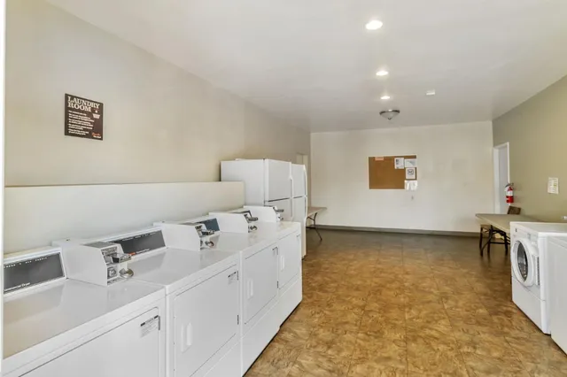 a bathroom with a bathtub sink and mirror