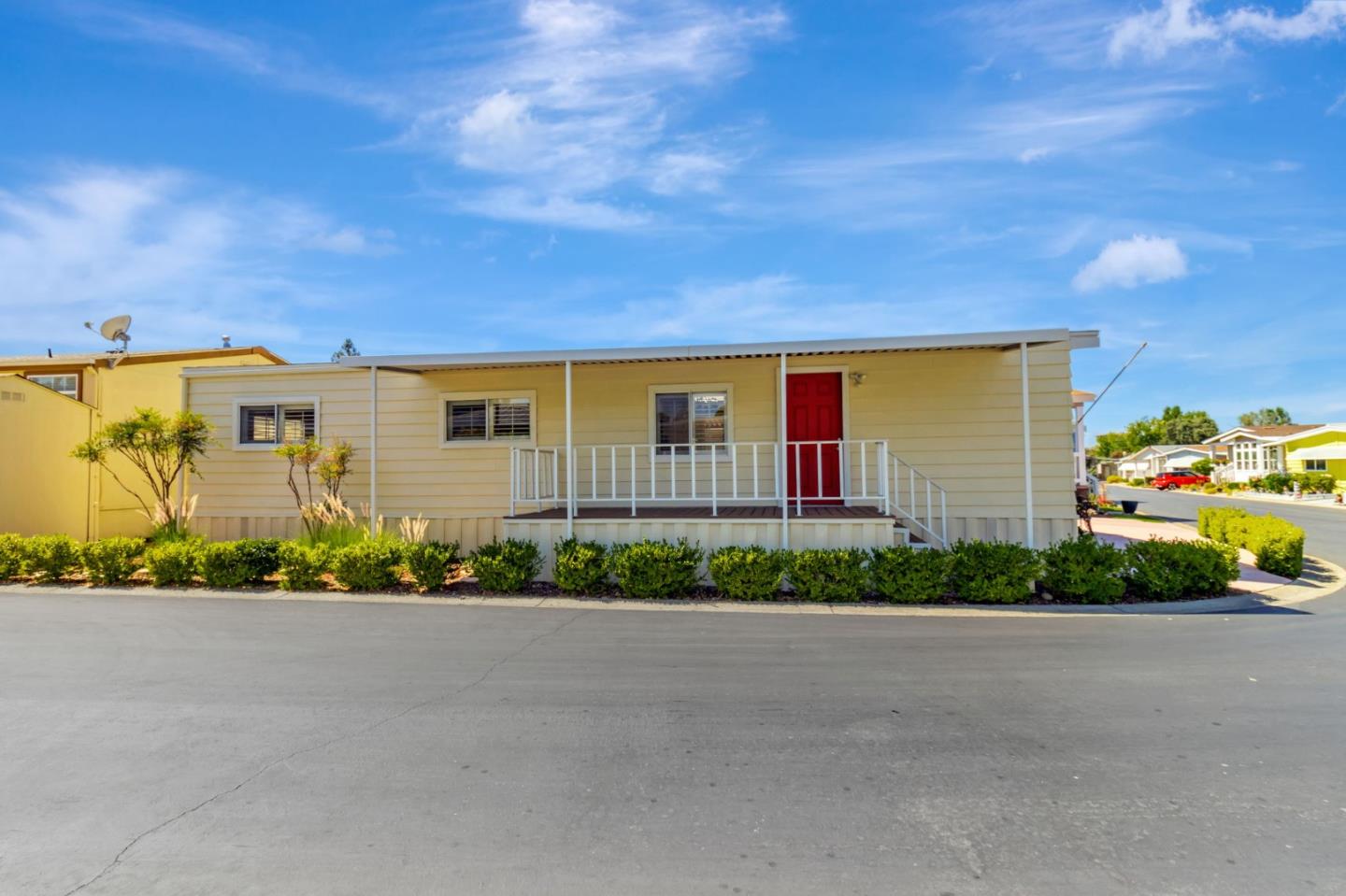 3263 Vineyard, Unit 132 Pleasanton, CA 94566 - Photo 3 of 34 a front view of a house with a garden