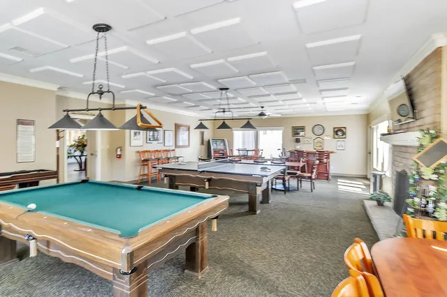 a living room with lots of furniture and appliances
