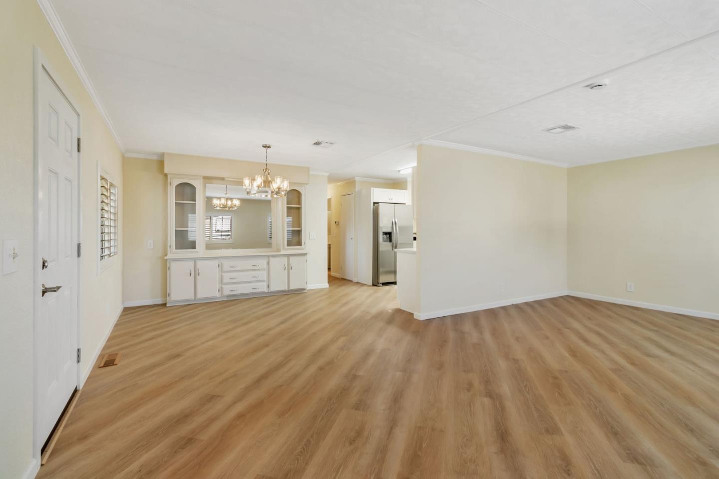 3263 Vineyard, Unit 132 Pleasanton, CA 94566 - Photo 8 of 34 an empty room with wooden floor and windows