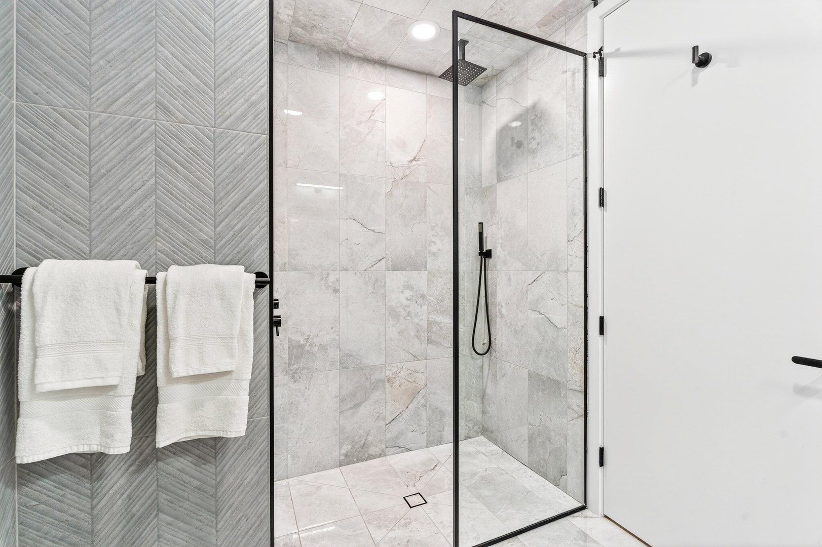 2024 West Irving Park Road, Unit 302 Chicago, IL 60618 - Photo 24 of 32 a bathroom with a glass shower door