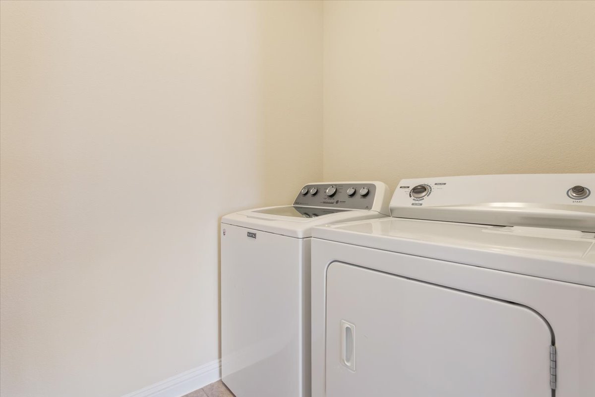 108 Cathedral Mountain Pass Georgetown, TX 78633 - Photo 30 of 36 a utility room with dryer and washer