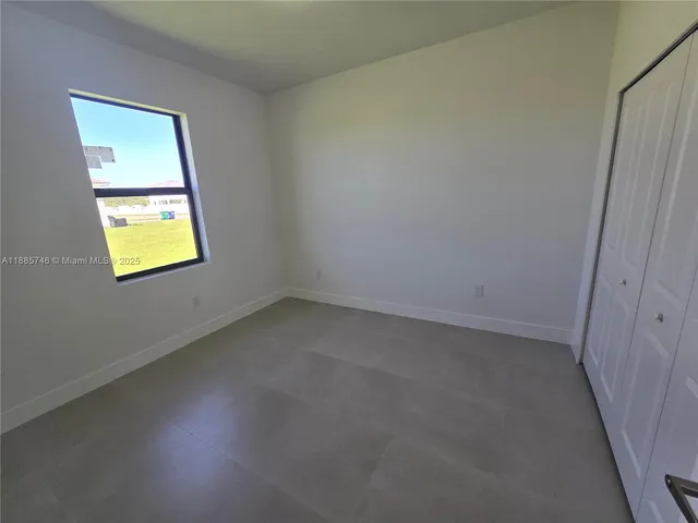 a view of a yard with an ocean