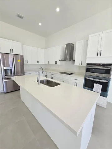 a bathroom with a sink a mirror and a shower