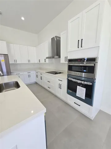 a view of a house with backyard and porch