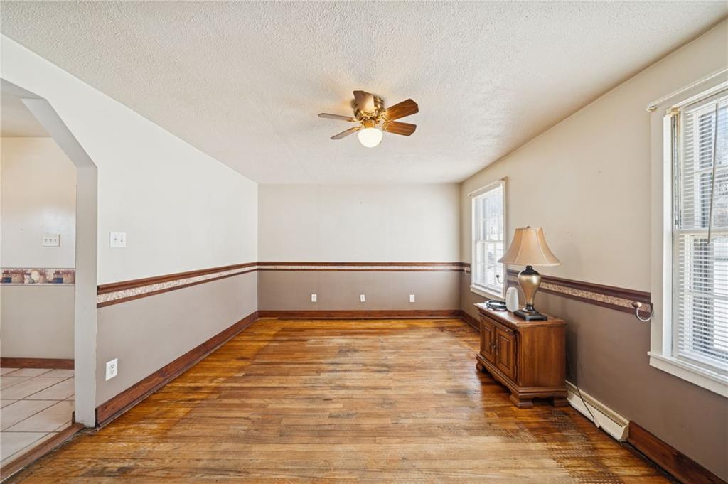 823 Arbor Lane Mount Pleasant, PA 15666 - Photo 11 of 37 a view of a room with gym equipment and windows
