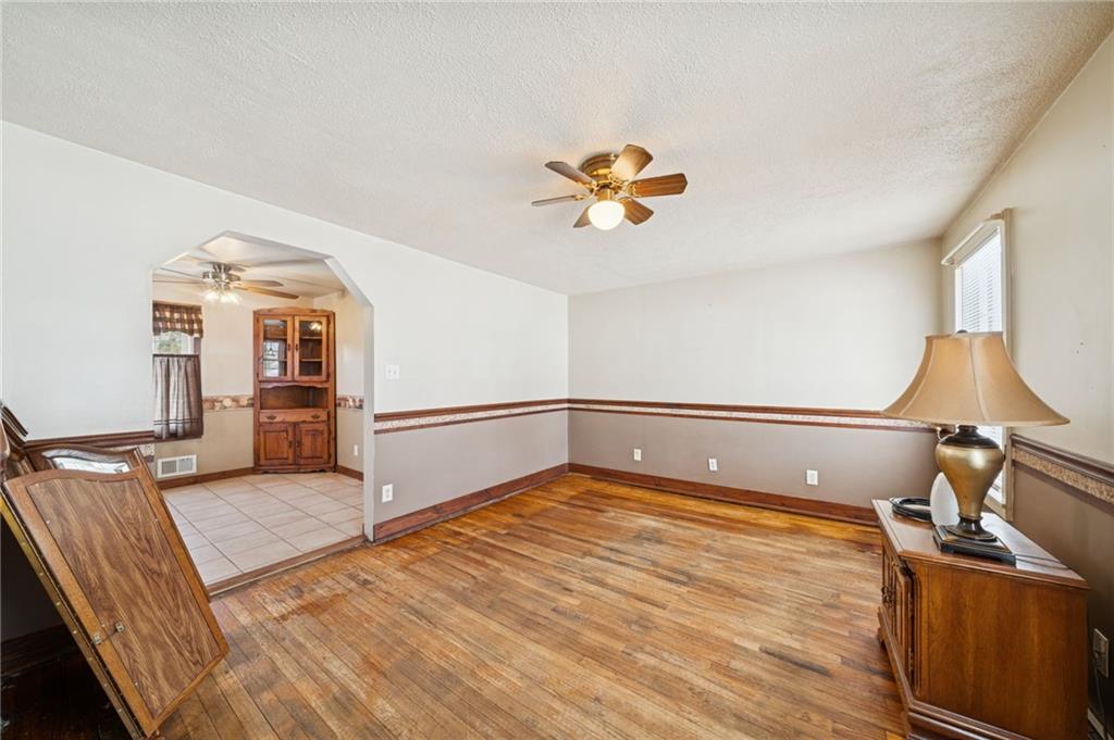 823 Arbor Lane Mount Pleasant, PA 15666 - Photo 12 of 37 a bedroom with a bed and wooden floor