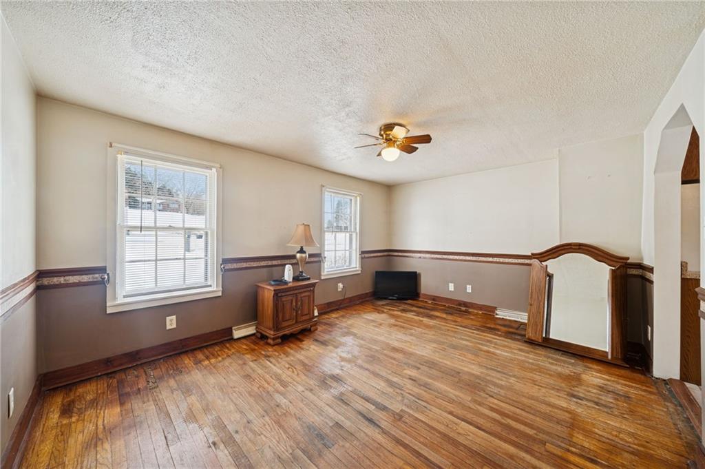 823 Arbor Lane Mount Pleasant, PA 15666 - Photo 13 of 37 a view of livingroom with hardwood