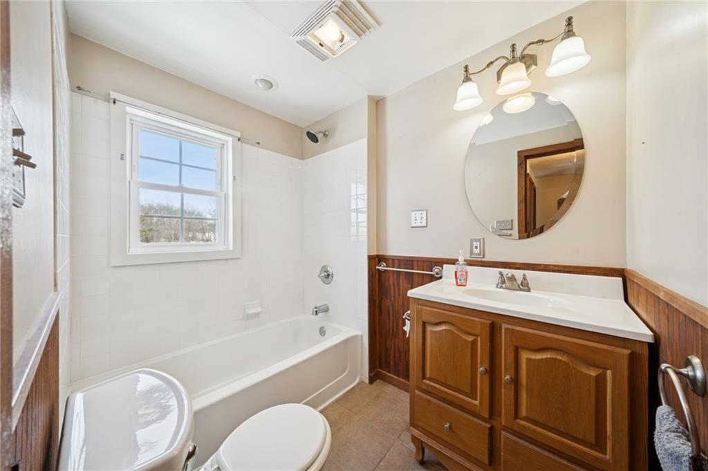 823 Arbor Lane Mount Pleasant, PA 15666 - Photo 17 of 37 a bathroom with a sink vanity mirror bathtub and toilet
