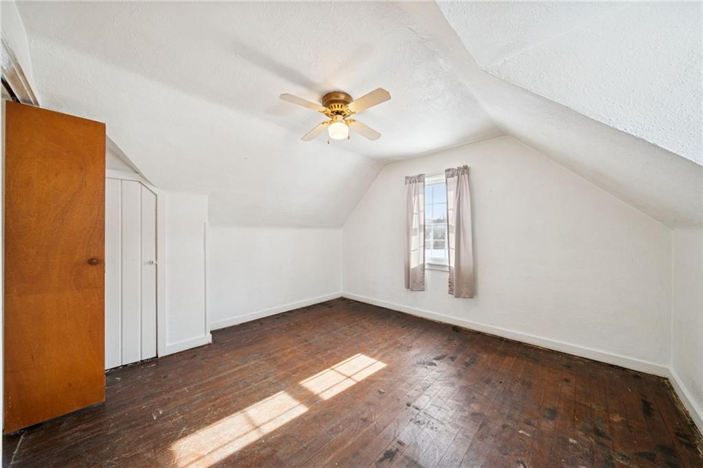 823 Arbor Lane Mount Pleasant, PA 15666 - Photo 19 of 37 a view of empty room with wooden floor and fan