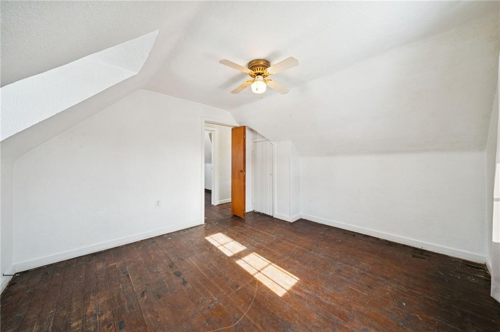 823 Arbor Lane Mount Pleasant, PA 15666 - Photo 20 of 37 a view of empty room with wooden floor and fan