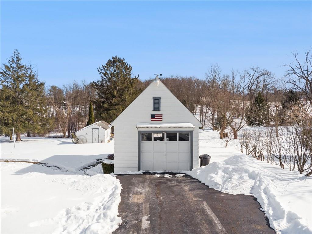 823 Arbor Lane Mount Pleasant, PA 15666 - Photo 29 of 37 a view of a house with a yard covered in snow
