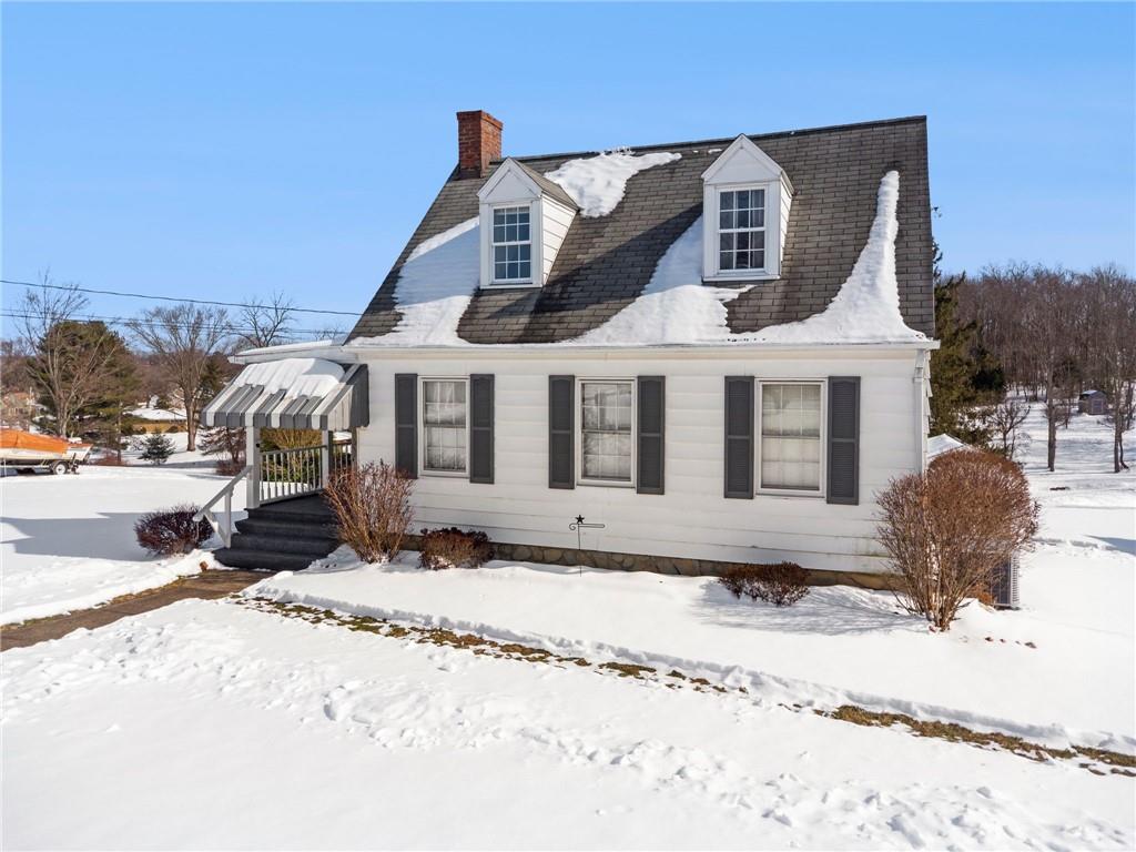 823 Arbor Lane Mount Pleasant, PA 15666 - Photo 31 of 37 a front view of a house with a yard