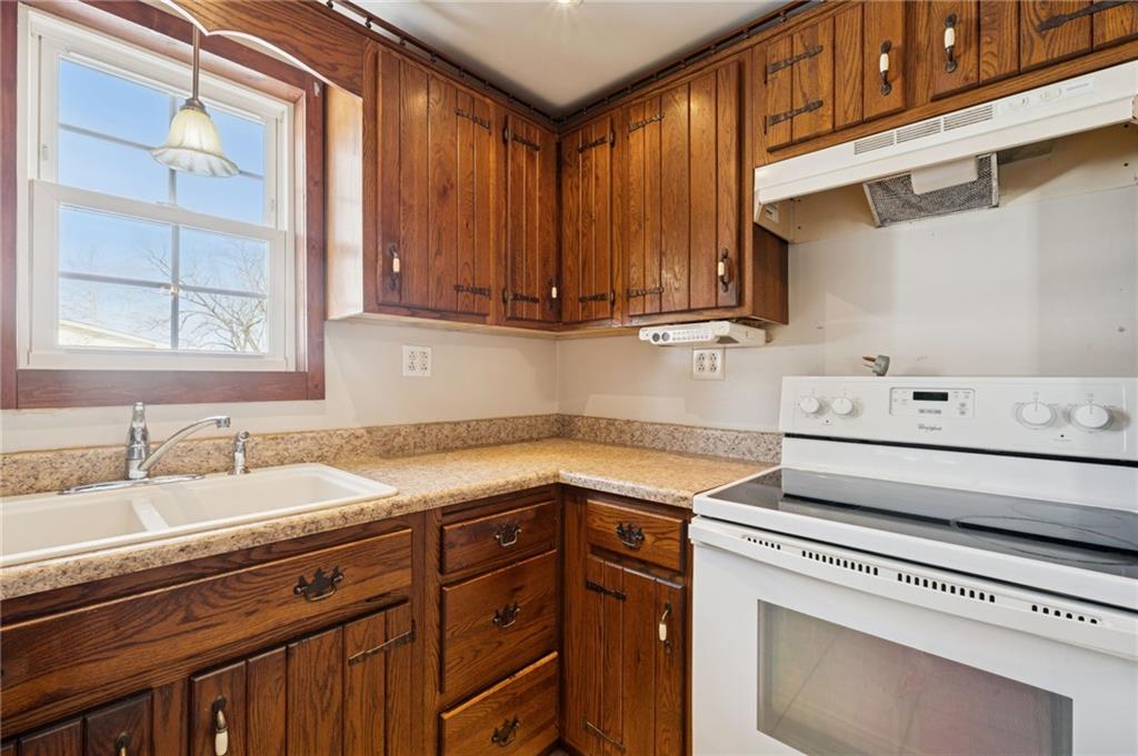 823 Arbor Lane Mount Pleasant, PA 15666 - Photo 5 of 37 a kitchen with a sink and cabinets