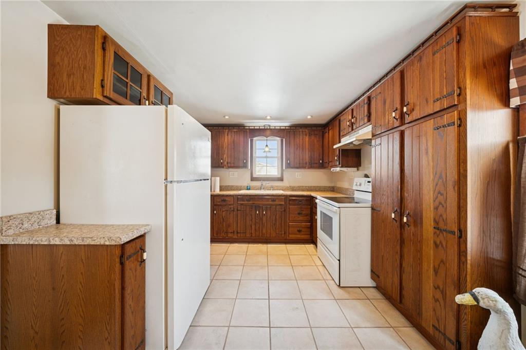 823 Arbor Lane Mount Pleasant, PA 15666 - Photo 10 of 37 a kitchen with stainless steel appliances granite countertop a refrigerator and a stove
