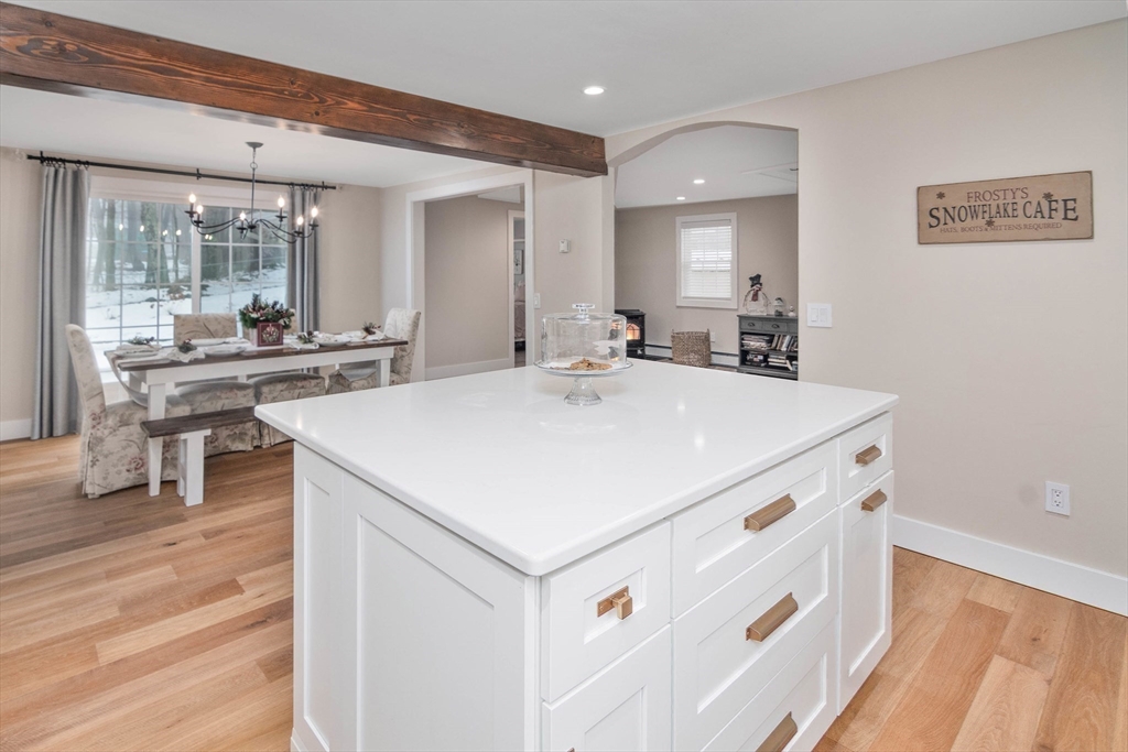 8 Edith Lane Rutland, MA 01543 - Photo 15 of 25 a view of kitchen island a sink and living room