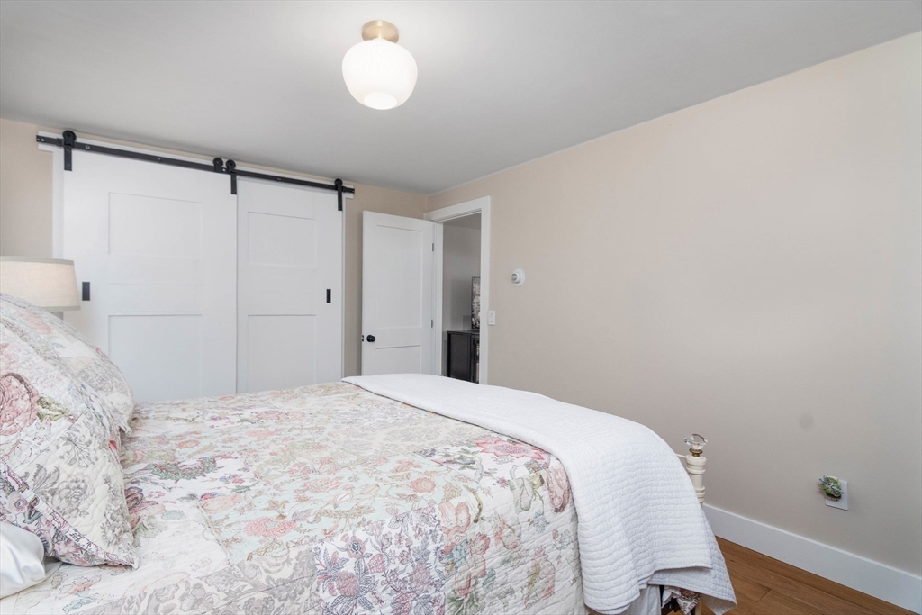 8 Edith Lane Rutland, MA 01543 - Photo 20 of 25 a bedroom with a bed and cabinets