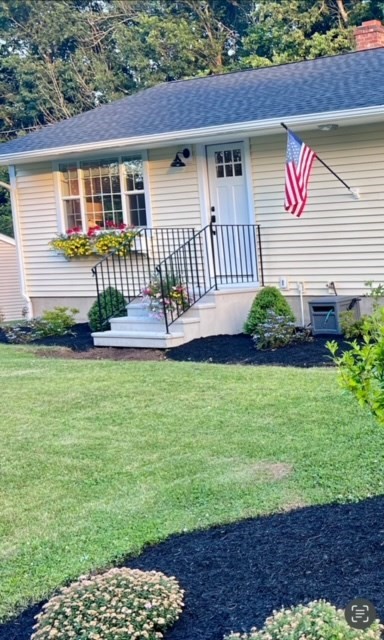 8 Edith Lane Rutland, MA 01543 - Photo 2 of 25 a front view of a house with garden