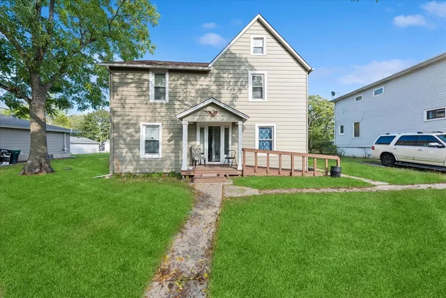 a front view of a house with a yard