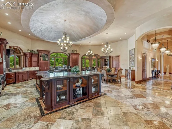 a stove top oven sitting inside of a kitchen