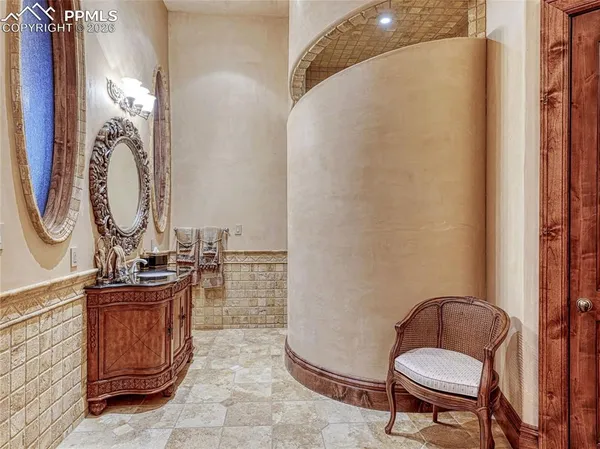 a bathroom with a sink mirror and toilet