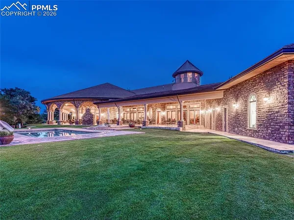 a view of a patio with a dining table and chairs with a patio