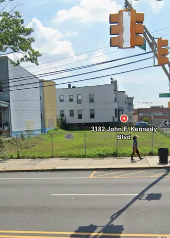a view of a building along a street