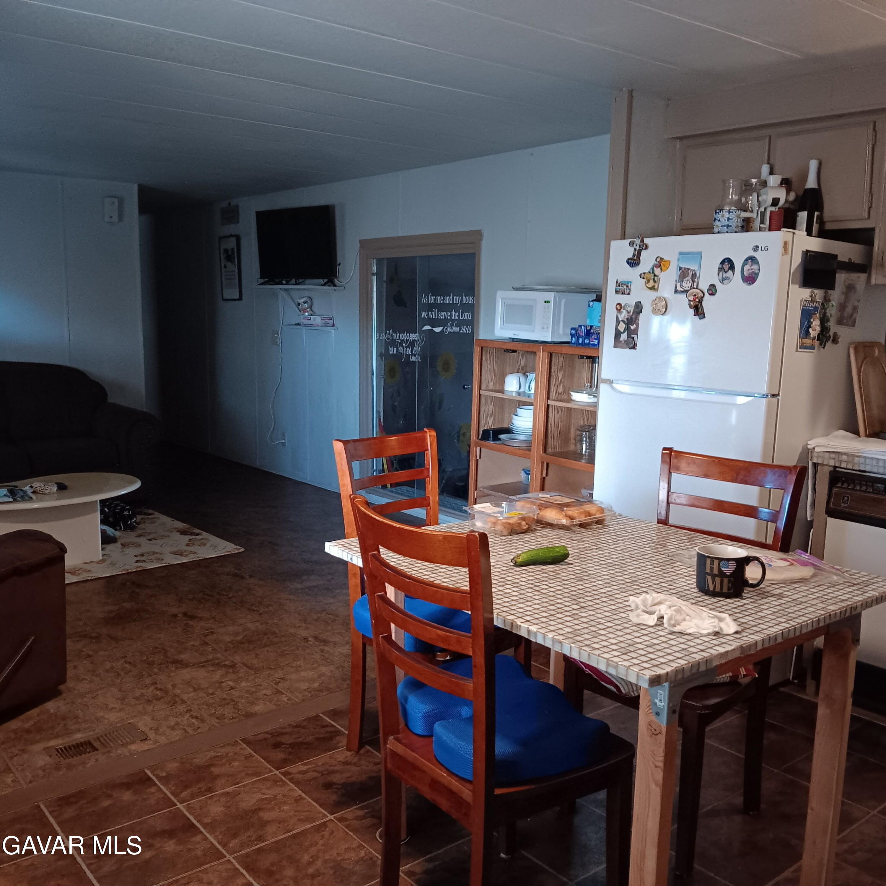 10364 15th Street Mojave, CA 93501 - Photo 15 of 15 a dining room with a table and chairs