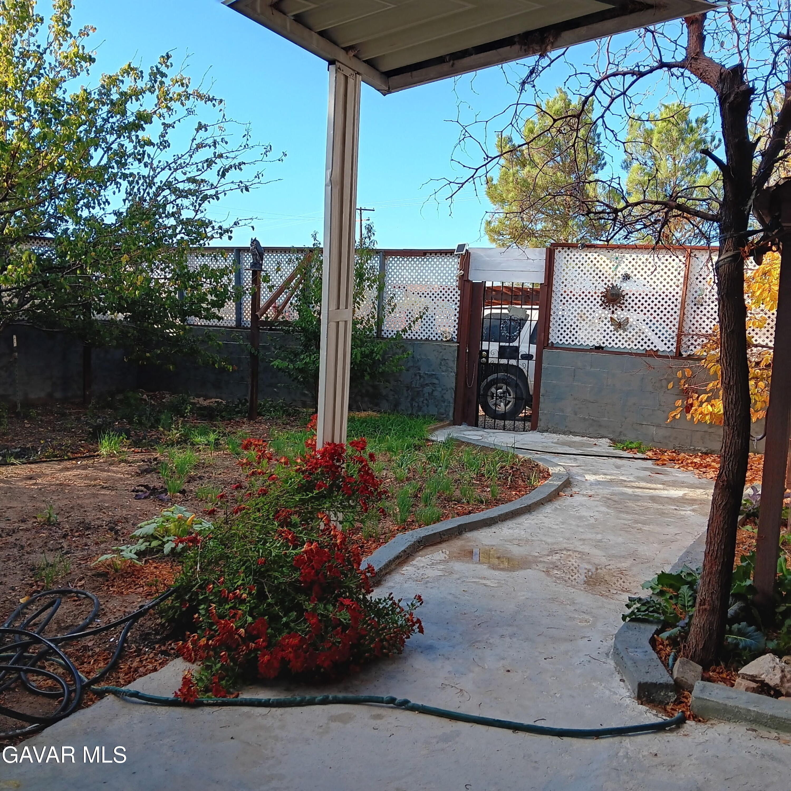 10364 15th Street Mojave, CA 93501 - Photo 5 of 15 a view of a bench in a yard