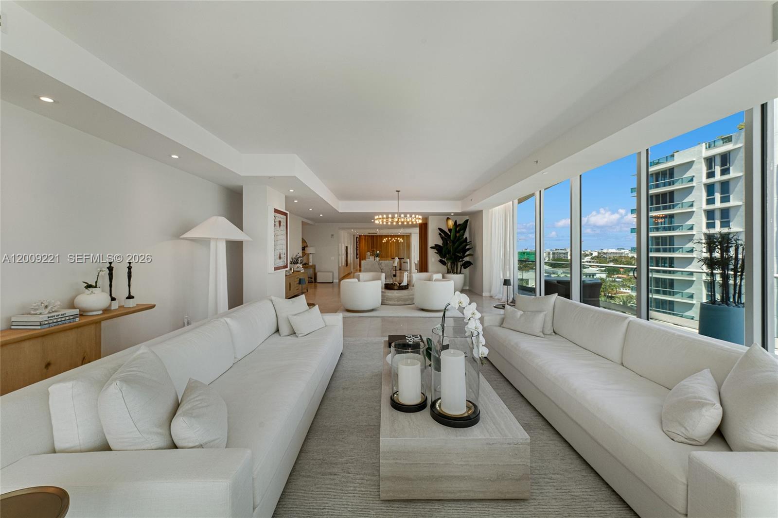 9349 Collins Avenue, Unit 801 Surfside, FL 33154 - Photo 12 of 59 a living room with furniture and a large window