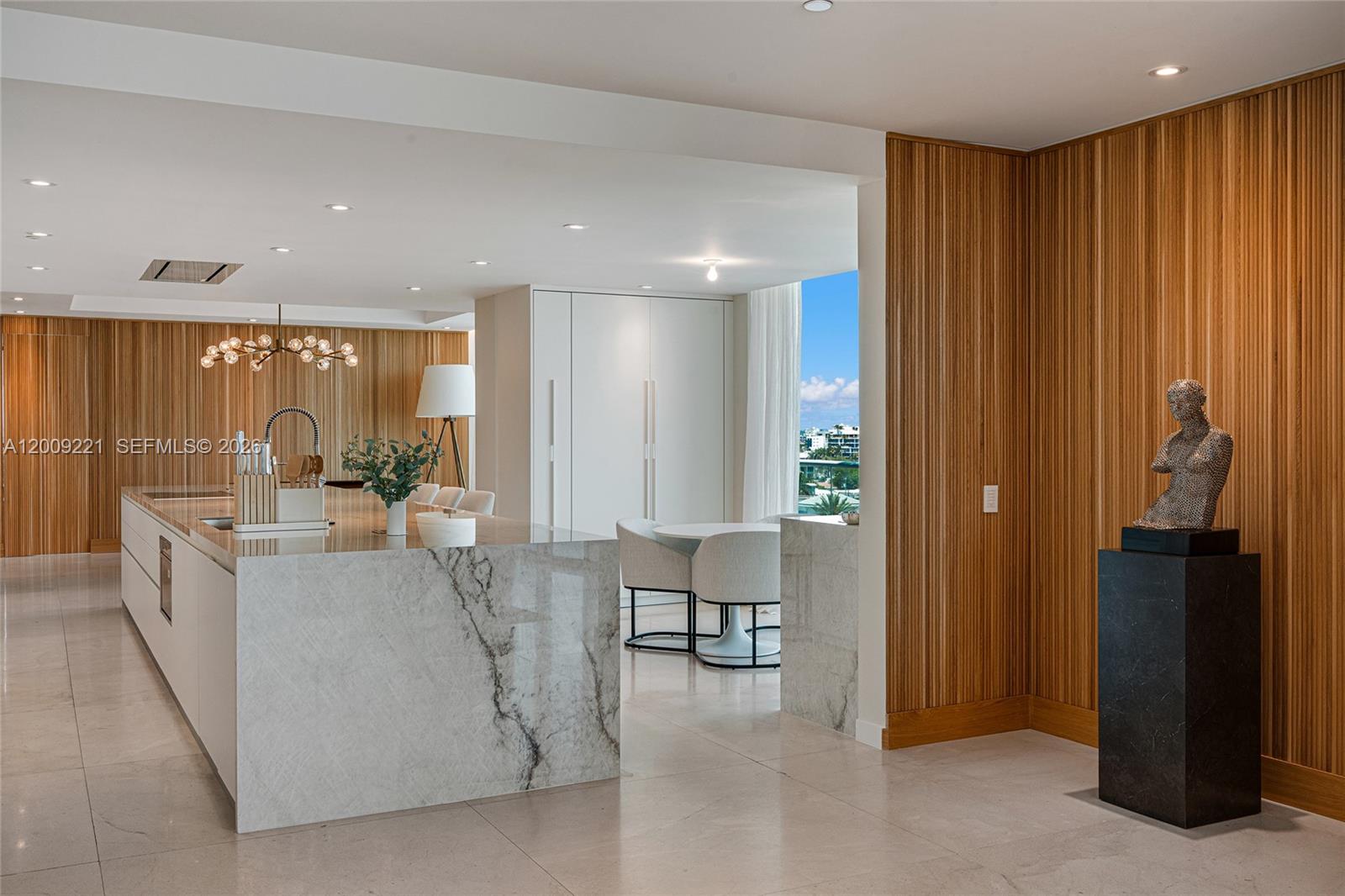 9349 Collins Avenue, Unit 801 Surfside, FL 33154 - Photo 13 of 59 a view of kitchen with furniture and refrigerator